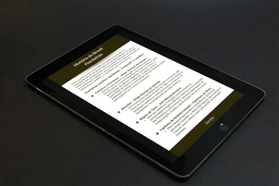 Tablet em cima de uma mesa cinza e a preview da lista de leitura sobre expansão das fronteiras do Brasil na tela ligada.